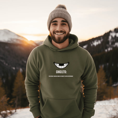 Our gender-neutral Chiclets hoodie is the ultimate statement piece for any hockey lover. Featuring a smiling mouth with missing front teeth, this hoodie perfectly captures the rugged and tough spirit of hockey players.