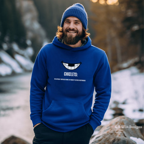 Our gender-neutral Chiclets hoodie is the ultimate statement piece for any hockey lover. Featuring a smiling mouth with missing front teeth, this hoodie perfectly captures the rugged and tough spirit of hockey players.