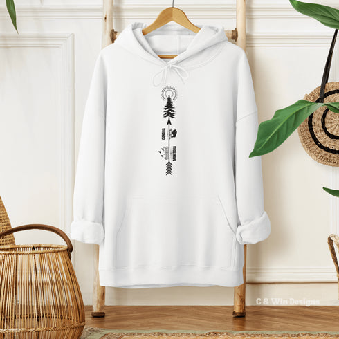 This hoodie features a unique design that showcases the beauty of Manitoba's nature icons, including prairie wheat, geese, bison, a camping scene, trees, and a big sun.