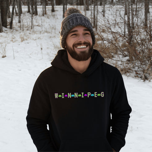This picture showcases the Winnipeg Retro Gaming Hoodie that has a bold green gaming font with space creatures separating the Winnipeg Letters