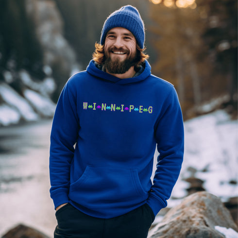 This picture showcases the Winnipeg Retro Gaming Hoodie that has a bold green gaming font with space creatures separating the Winnipeg Letters