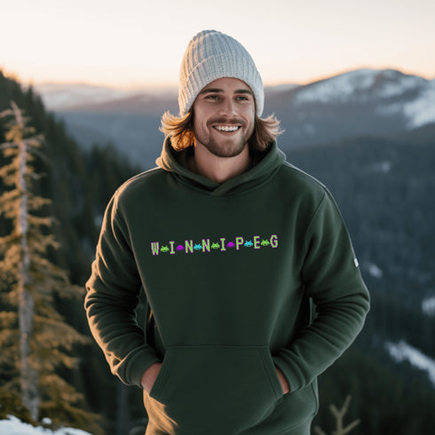 This picture showcases the Winnipeg Retro Gaming Hoodie that has a bold green gaming font with space creatures separating the Winnipeg Letters