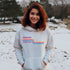This gender neutral hoodie features a colorful line graphic that pays homage to the vibrant city of Winnipeg, Manitoba.