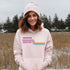 This gender neutral hoodie features a colorful line graphic that pays homage to the vibrant city of Winnipeg, Manitoba.