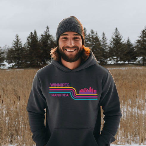 This gender neutral hoodie features A Winnipeg City Skyline and colored retro Stripes across the front.