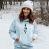 This hoodie features an eye-catching graphic that includes a Polar bear, a Wolf howling at the moon, and a tree with a sun.