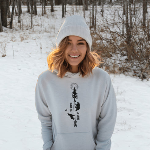 This hoodie features an eye-catching graphic that includes a Polar bear, a Wolf howling at the moon, and a tree with a sun.