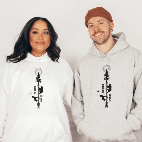 This hoodie features an eye-catching graphic that includes a Polar bear, a Wolf howling at the moon, and a tree with a sun.