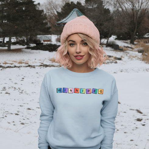 Introducing our newest addition to your wardrobe - the trendy graphic sweatshirt featuring colorful Winnipeg Scrabble Titles.