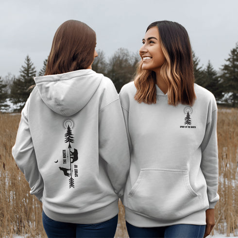 This hoodie features an eye-catching graphic that includes a Polar bear, a Wolf howling at the moon, and a tree with a sun.
