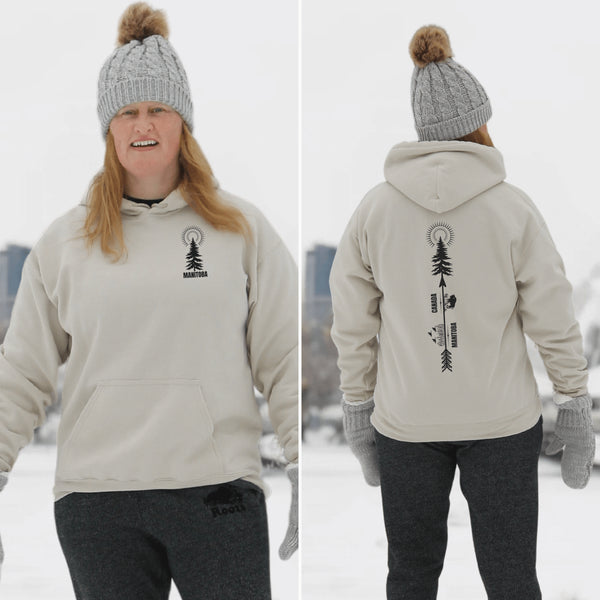 This hoodie features a unique design that showcases the beauty of Manitoba's nature icons, including prairie wheat, geese, bison, trees, and a big sun.