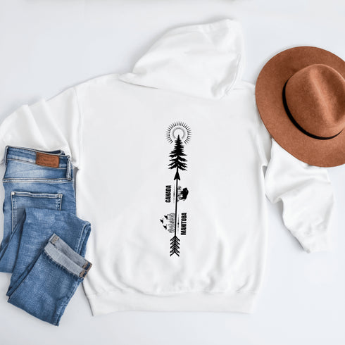 This hoodie features a unique design that showcases the beauty of Manitoba's nature icons, including prairie wheat, geese, bison, trees, and a big sun.