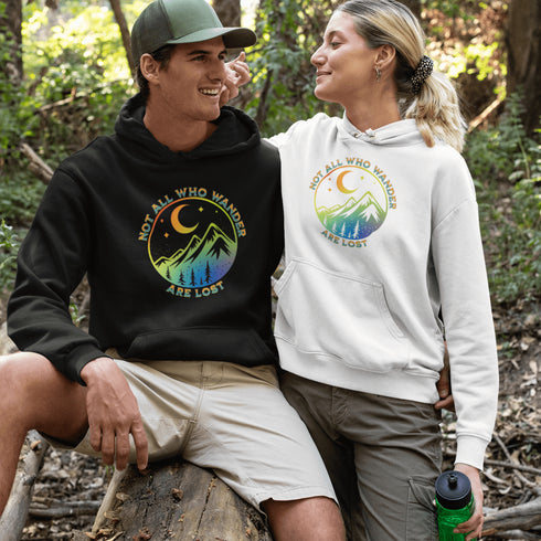 This hoodie features a colorful mountain graphic on the front and the inspiring saying "Not All Who Wander Are Lost" printed on the front.