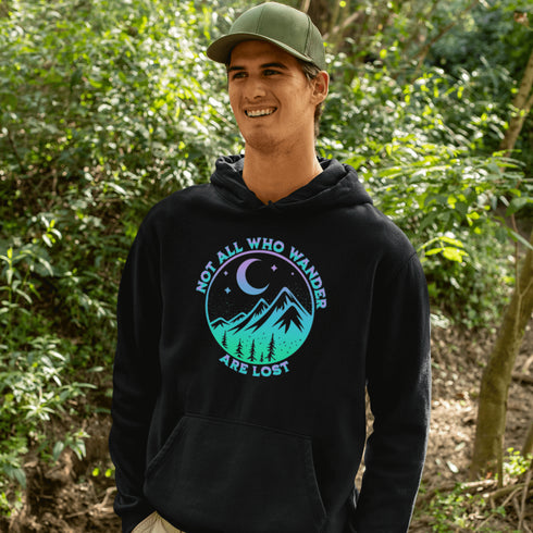 Introducing the perfect addition to your camping wardrobe - our one-of-a-kind hoodie featuring a colorful mountain graphic and the inspiring statement "Not All Who Wander Are Lost".