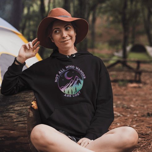 Introducing the perfect hoodie for your next outdoor adventure - our colorful mountain graphic hoodie that says "Not All Who Wander Are Lost".