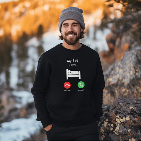 Introducing the ultimate sweatshirt for all those who love their bed more than anything else - the My Bed Is Calling Sweatshirt! Featuring a hilarious stick figure lying in bed, this sweatshirt is the perfect way to show off your love for all things cozy and comfortable.