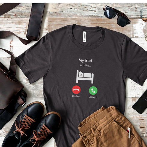 Introducing the ultimate t-shirt for all those who love their bed more than anything else - the My Bed Is Calling tee! Featuring a hilarious stick figure lying in bed, this tee is the perfect way to show off your love for all things cool and comfortable.