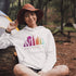 This Camping hoodie features a stunning colorful gradient forest graphic that captures the essence of the great outdoors. With the inspiring saying "WILD-Not All Who Wander Are Lost" boldly printed, it serves as a reminder to embrace your wild spirit and wanderlust.