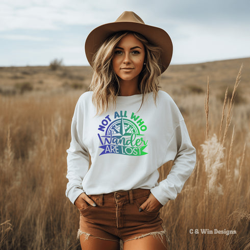 This sweatshirt features a stunning colorful gradient graphic that will make you stand out on your outdoor escapades. With the inspiring saying "Not All Who Wander Are Lost" emblazoned across the front, this sweater is not just a piece of clothing, but a statement of your adventurous spirit and love for exploration.