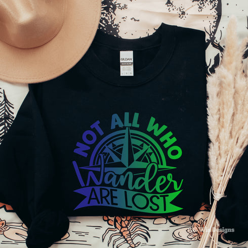 This sweatshirt features a stunning colorful gradient graphic that will make you stand out on your outdoor escapades. With the inspiring saying "Not All Who Wander Are Lost" emblazoned across the front, this sweater is not just a piece of clothing, but a statement of your adventurous spirit and love for exploration.