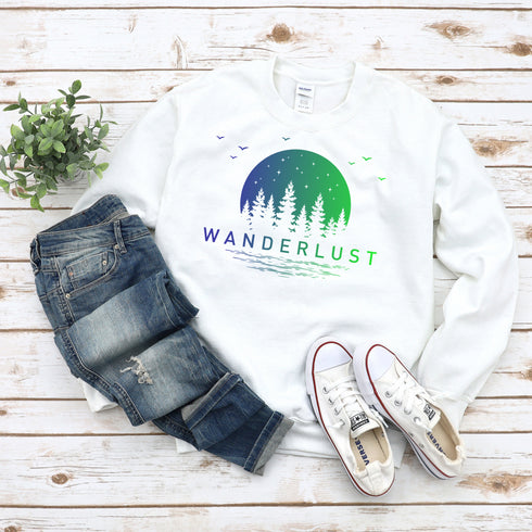 This crewneck features a vibrant and colorful gradient nature scene that will transport you to the great outdoors every time you wear it. The word "Wanderlust" emblazoned across the front serves as a reminder of your passion for exploration and the call of the wild.