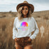 This crewneck features a vibrant and colorful gradient nature scene that will transport you to the great outdoors every time you wear it. The word "Wanderlust" emblazoned across the front serves as a reminder of your passion for exploration and the call of the wild.