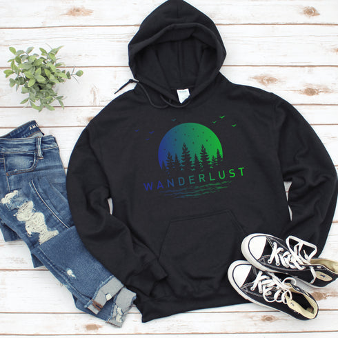 This hooded sweatshirt features a vibrant and colorful gradient nature scene that will transport you to the great outdoors every time you wear it. The word "Wanderlust" emblazoned across the front serves as a reminder of your passion for exploration and the call of the wild.