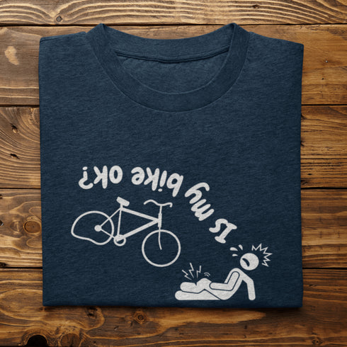 This hilarious design features a stick man in a classic bike fail moment - falling off a bike with a flat tire, all while asking the important question upside down.