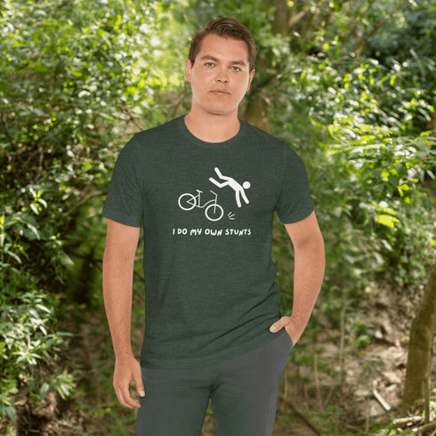 Introducing our latest masterpiece in the world of fashion disasters - the "I Do My Own Stunts" t-shirt! Picture this: a daring stick figure attempting to defy gravity on a bike, only to end up in a spectacular crash landing.