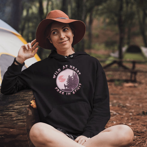 Introducing our gender neutral hoodie featuring a stunning graphic of a wolf howling at the moon with the inspiring message "Wild At Heart, Free In Spirit".