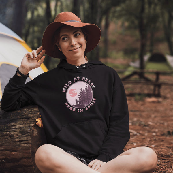 Introducing our gender neutral hoodie featuring a stunning graphic of a wolf howling at the moon with the inspiring message "Wild At Heart, Free In Spirit".