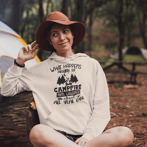 Introducing our gender neutral hoodie featuring a fun camping graphic and the popular saying "What Happens Around The Campfire Gets Laughed About All Year Long."