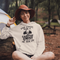 Introducing our gender neutral hoodie featuring a fun camping graphic and the popular saying "What Happens Around The Campfire Gets Laughed About All Year Long."