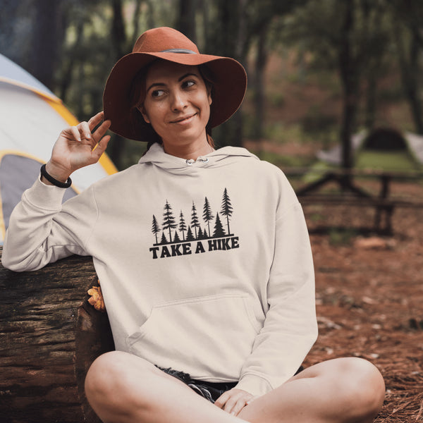 Introducing our gender-neutral hoodie featuring a stunning forest scene and the motivational slogan "Take A Hike".