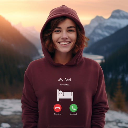 Introducing the ultimate hoodie for all those who love their bed more than anything else - the My Bed Is Calling hoodie! Featuring a hilarious stick figure lying in bed, this sweater is the perfect way to show off your love for all things cozy and comfortable.