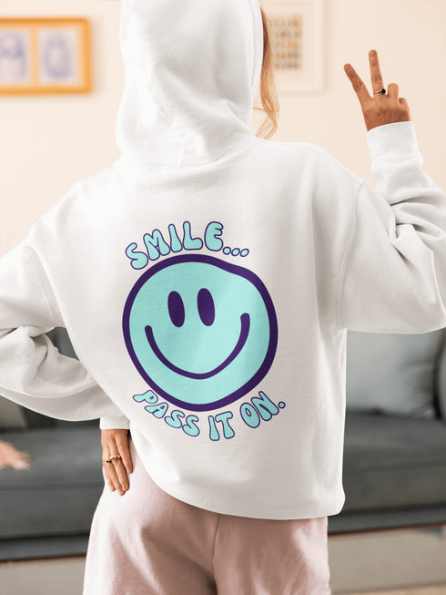 Introducing the latest must-have in your wardrobe that's guaranteed to turn frowns upside down: the Happy Face Hoodie emblazoned with the cheer-spreading command, "Smile...Pass it on." This isn't just any ordinary hoodie; it's your ticket to becoming a walking, talking (and very cozy) ambassador of joy!