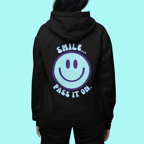 Introducing the latest must-have in your wardrobe that's guaranteed to turn frowns upside down: the Happy Face Hoodie emblazoned with the cheer-spreading command, "Smile...Pass it on." This isn't just any ordinary hoodie; it's your ticket to becoming a walking, talking (and very cozy) ambassador of joy!