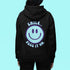Introducing the latest must-have in your wardrobe that's guaranteed to turn frowns upside down: the Happy Face Hoodie emblazoned with the cheer-spreading command, "Smile...Pass it on." This isn't just any ordinary hoodie; it's your ticket to becoming a walking, talking (and very cozy) ambassador of joy!