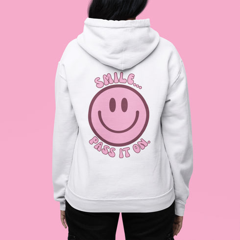 Introducing the latest must-have in your wardrobe that's guaranteed to turn frowns upside down: the Happy Face Hoodie emblazoned with the cheer-spreading command, "Smile...Pass it on." This isn't just any ordinary hoodie; it's your ticket to becoming a walking, talking (and very cozy) ambassador of joy!
