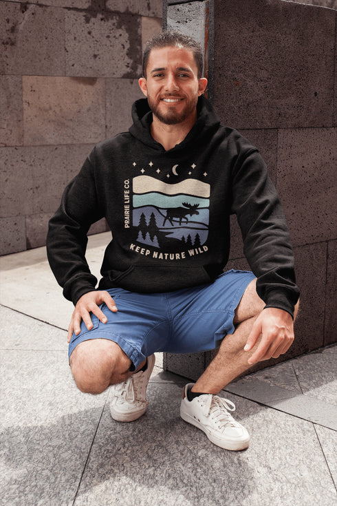 Featuring a moose design paired with a nature-inspired landscape, this hoodie reflects the beauty of Canada’s wild spaces and the importance of protecting them.