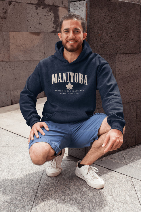 Manitoba Rooted in the Heartland hoodie with maple leaf and vintage collegiate lettering on a unisex Gildan sweatshirt