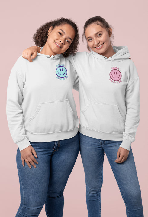 Introducing the latest must-have in your wardrobe that's guaranteed to turn frowns upside down: the Happy Face Hoodie emblazoned with the cheer-spreading command, "Smile...Pass it on." This isn't just any ordinary hoodie; it's your ticket to becoming a walking, talking (and very cozy) ambassador of joy!