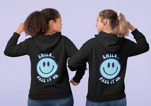 Introducing the latest must-have in your wardrobe that's guaranteed to turn frowns upside down: the Happy Face Hoodie emblazoned with the cheer-spreading command, "Smile...Pass it on." This isn't just any ordinary hoodie; it's your ticket to becoming a walking, talking (and very cozy) ambassador of joy!