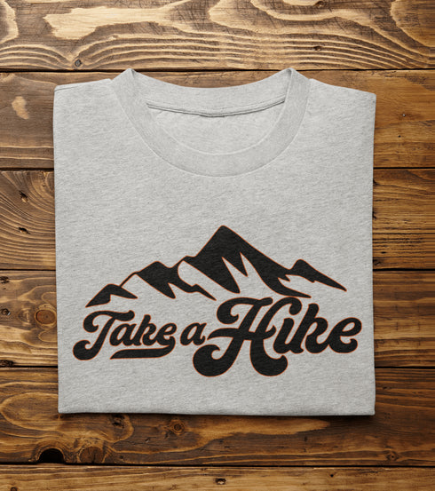 Introducing our rugged and stylish hiking t-shirt, perfect for outdoor enthusiasts and nature lovers alike. Featuring a striking mountain graphic and the motivational slogan "Take A Hike", this shirt is designed to inspire your next camping adventure.