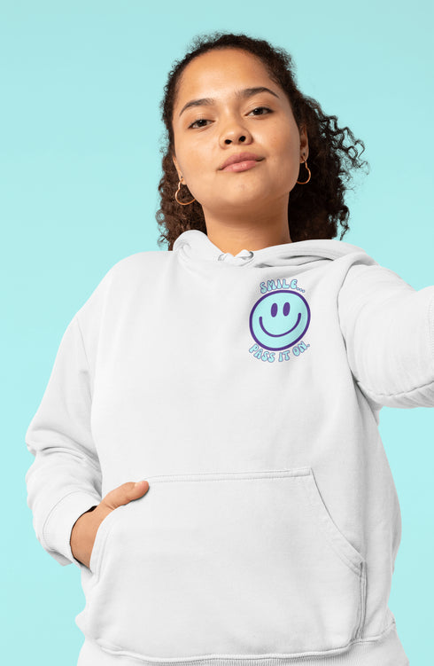 Introducing the latest must-have in your wardrobe that's guaranteed to turn frowns upside down: the Happy Face Hoodie emblazoned with the cheer-spreading command, "Smile...Pass it on." This isn't just any ordinary hoodie; it's your ticket to becoming a walking, talking (and very cozy) ambassador of joy!