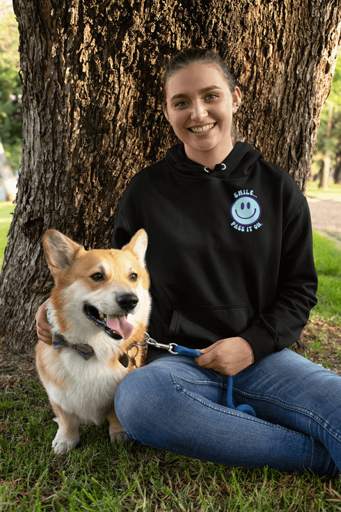 Introducing the latest must-have in your wardrobe that's guaranteed to turn frowns upside down: the Happy Face Hoodie emblazoned with the cheer-spreading command, "Smile...Pass it on." This isn't just any ordinary hoodie; it's your ticket to becoming a walking, talking (and very cozy) ambassador of joy!