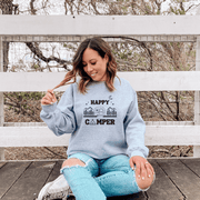 Introducing our Happy Camper sweatshirt, perfect for any outdoor enthusiast! Made from high-quality, soft material, this gender-neutral sweatshirt features a beautiful mountain camping scene that will inspire you to explore the great outdoors. 