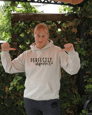 Introducing our latest addition to the collection - the gender-neutral hoodie with the inspiring message "Perfectly Imperfect". Made from high-quality materials, this sweater is designed to be both comfortable and durable. 