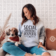 Introducing the ultimate fashion statement for introverts and homebodies everywhere: the Social Distancing Expert sweatshirt! Made with premium quality material, this sweatshirt is perfect for those who love to stay snuggled up at home and avoid social interaction at all costs. With its eye-catching design and hilarious slogan, this gender neutral sweatshirt is sure to turn heads and get laughs wherever you go. 