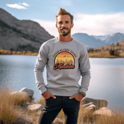Introducing the perfect addition to your wardrobe for those chilly Canadian nights - our gender neutral Manitoba Home Sweet Home Sweatshirt! Designed with a stunning Prairie sunset, complete with wheat and the phrase "Home Sweet Home Manitoba," this sweater is not only stylish but also serves as a nod to your love for the beautiful Canadian nature. 